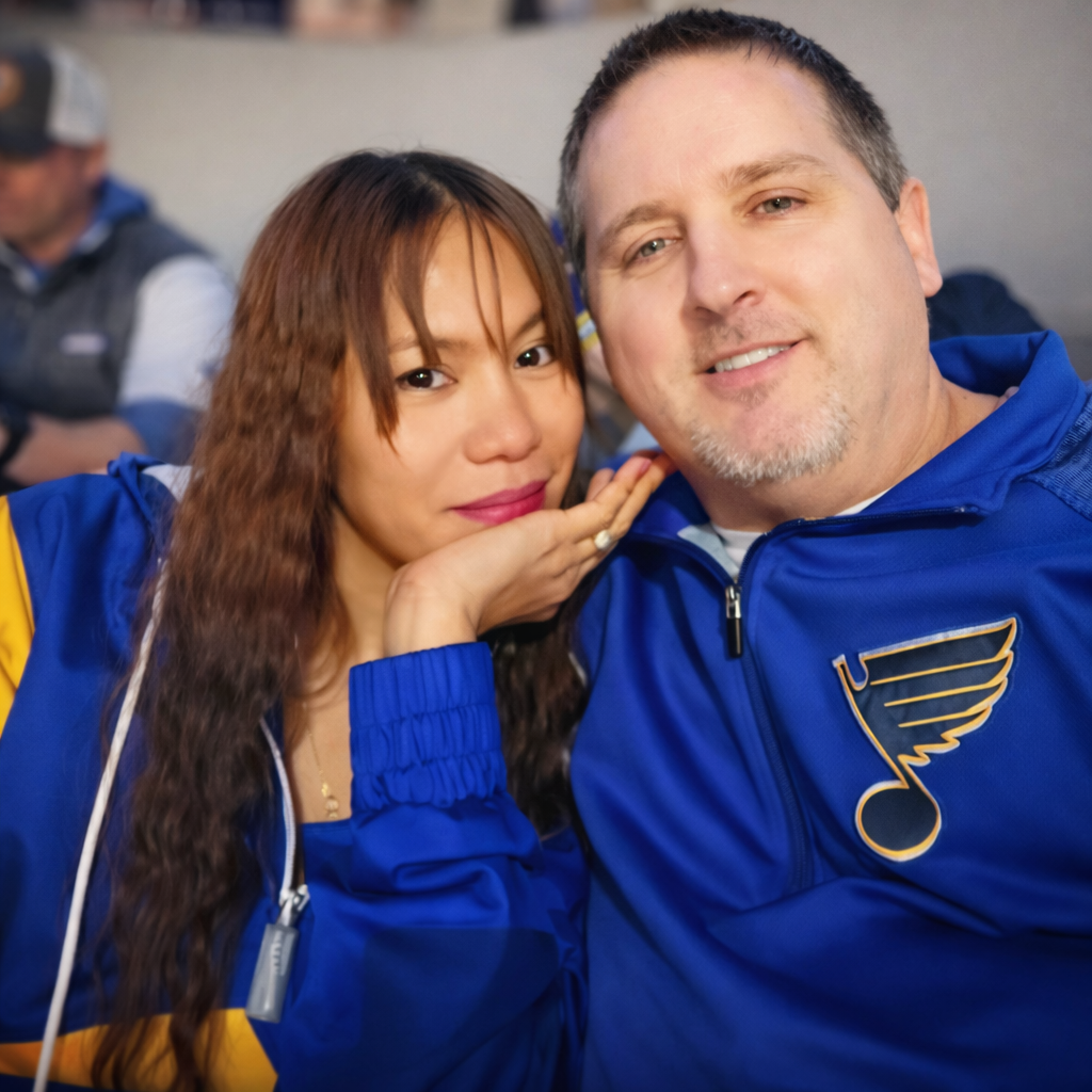 Mrs. Sparkle Cleaning Co. owners in St. Louis Blues gear